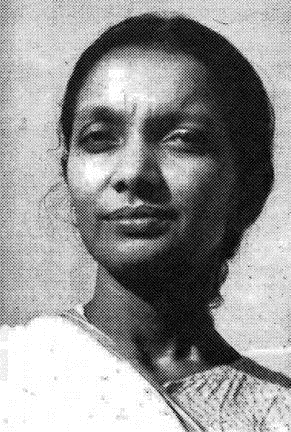 Archival halftone photograph of Kalpana Datta in later life, in a light sari with her hair drawn back, looking directly at the camera.