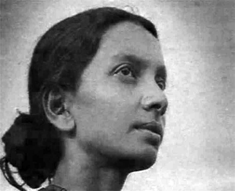 Archival photograph of a young Kalpana Datta in three-quarter profile, looking upward.